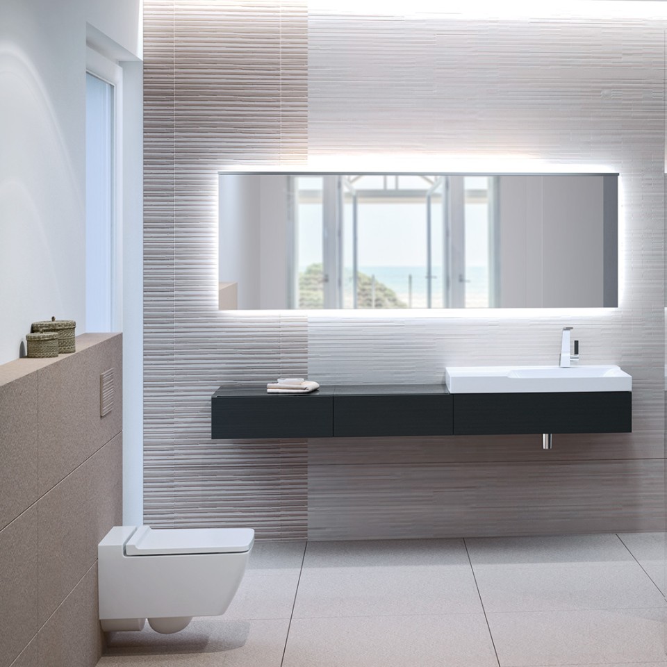 Kúpeľňa s toaletou bez splachovacieho okraja Geberit Xeno², ovládacím tlačidlom Sigma70 a umývadlom