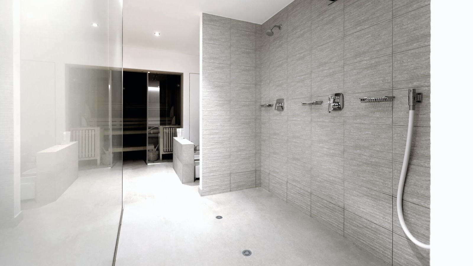 Poloverejná sanitárna miestnosť s vinylovou (PVC) podlahou a odtokom Geberit