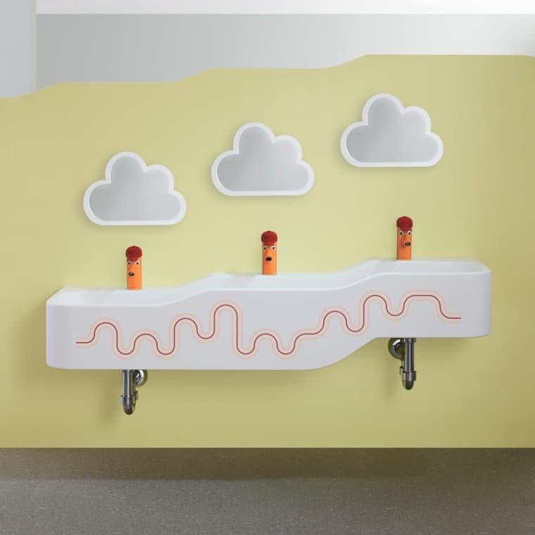 Priestor na hranie a umývanie Geberit Bambini v karmínovej červenej a oranžovej farbe Priestor na hranie a umývanie Geberit Bambini v karmínovej červenej a oranžovej farbe